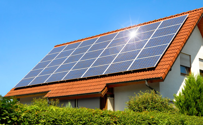 Solar panel on a red roof